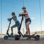 riders enjoying an outdoor adventure on KuKirin G2 Ultra all-terrain scooters.